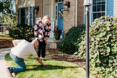 Customers looking at their green lawn.